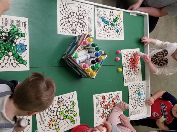 kids coloring around table